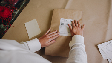 Customer preparing to send a small parcel